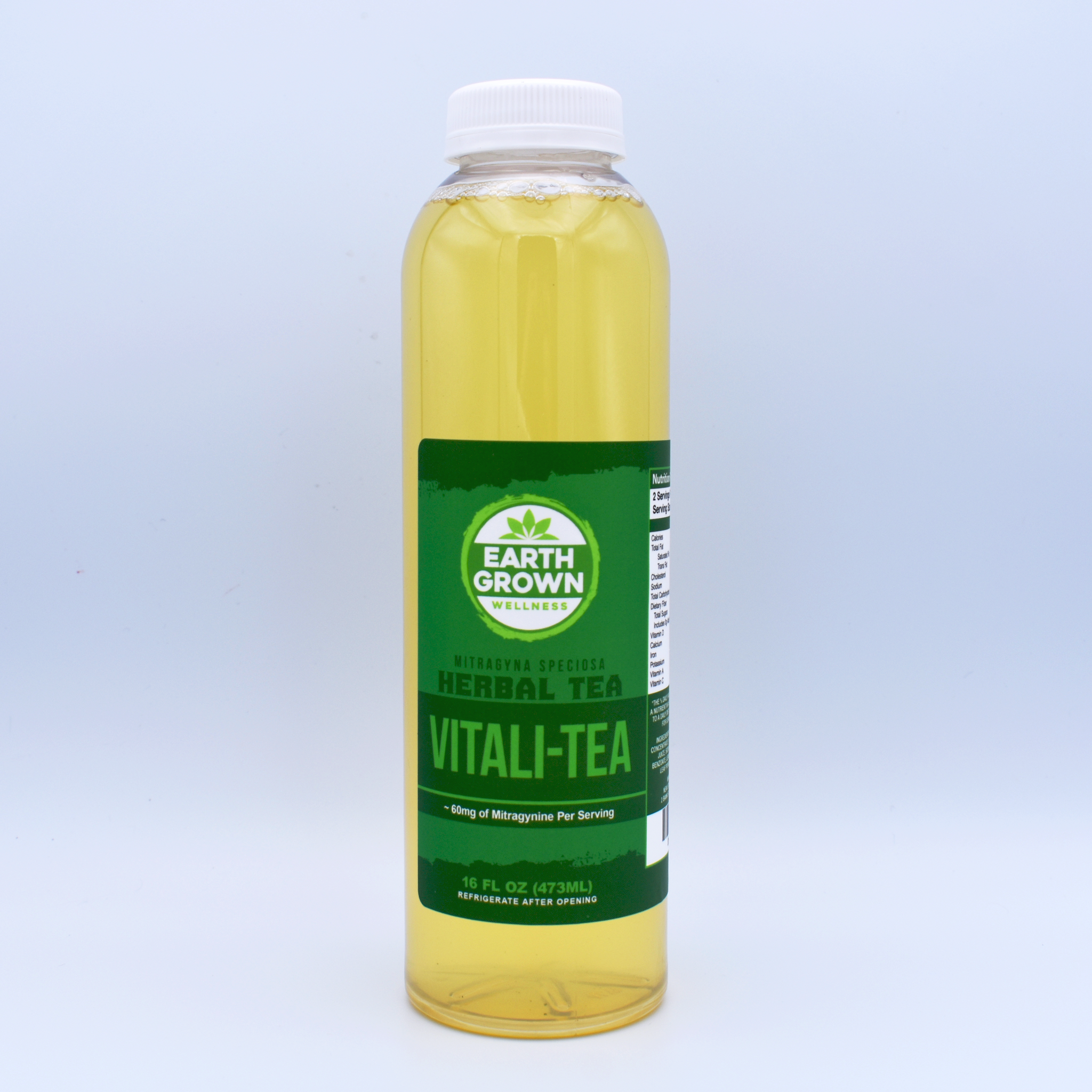 A bottle of Earth Grown Wellness brand Kratom Vitali-Tea sits on a white background. Green label.